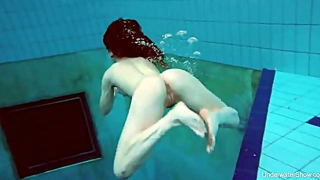 College girl goes swimming and strips underwater