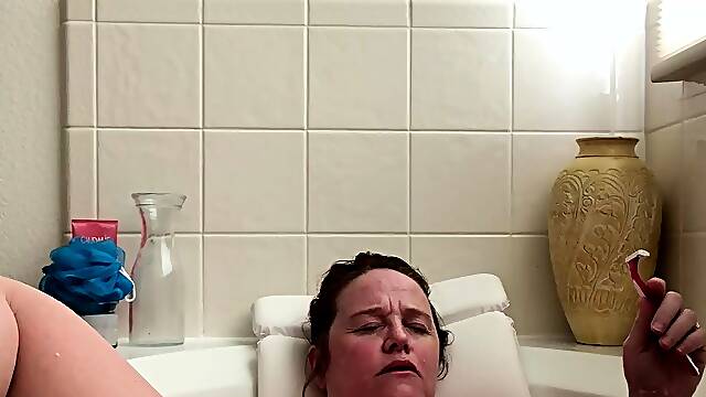 Attractive brunette teenager with big boobs fingering pussy