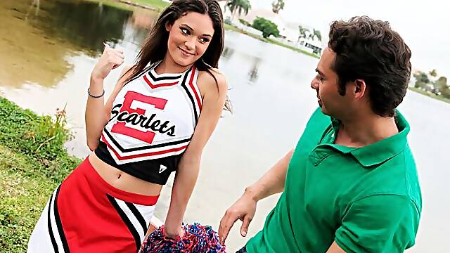 Cheerleader Monica Guides Her Pussy Onto A Stiff Cock