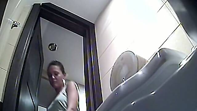 Incredible teen white ass of a hot brunette filmed in the toilet room