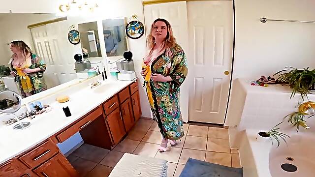 The blonde woman is on her knees and ready to suck