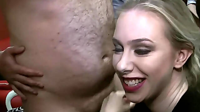 Busty blonde babe in stockings gets gangbanged at bukkake party