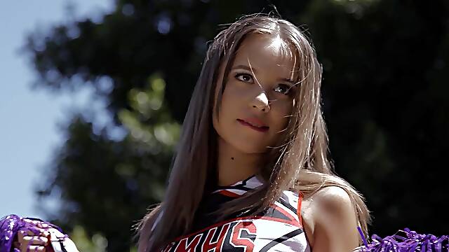 Naughty cheerleader Liza Rowe drops her uniform for a black dick