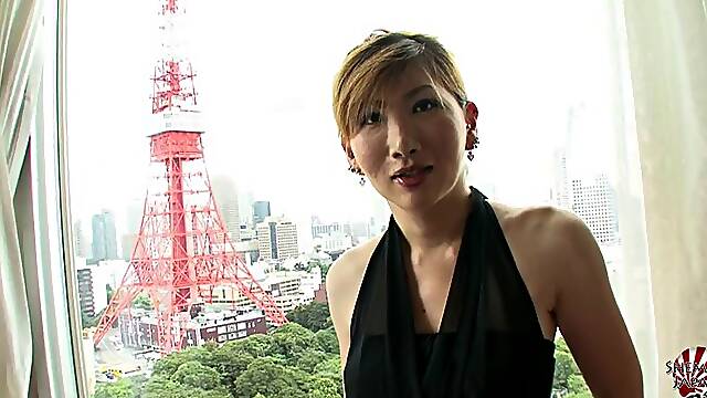 Classy Japanese tranny with big tits strokes her dick