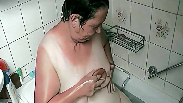 Grandparents wash each other's genitals