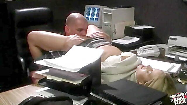 Taking Deep Anal Thrusts in the Office While Rubbing Herself Makes the Blonde Soaking Wet