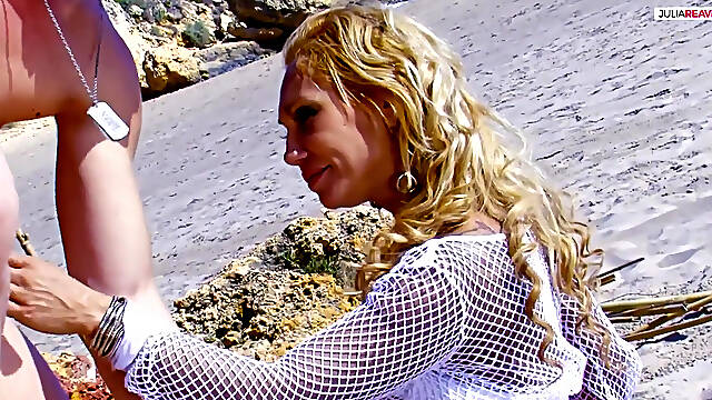 Sexy blonde rides a huge cock on the beach to a cumshot