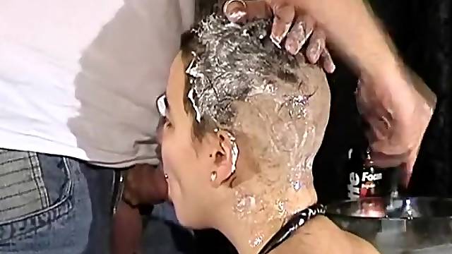 Shaving her head as she sucks his dick
